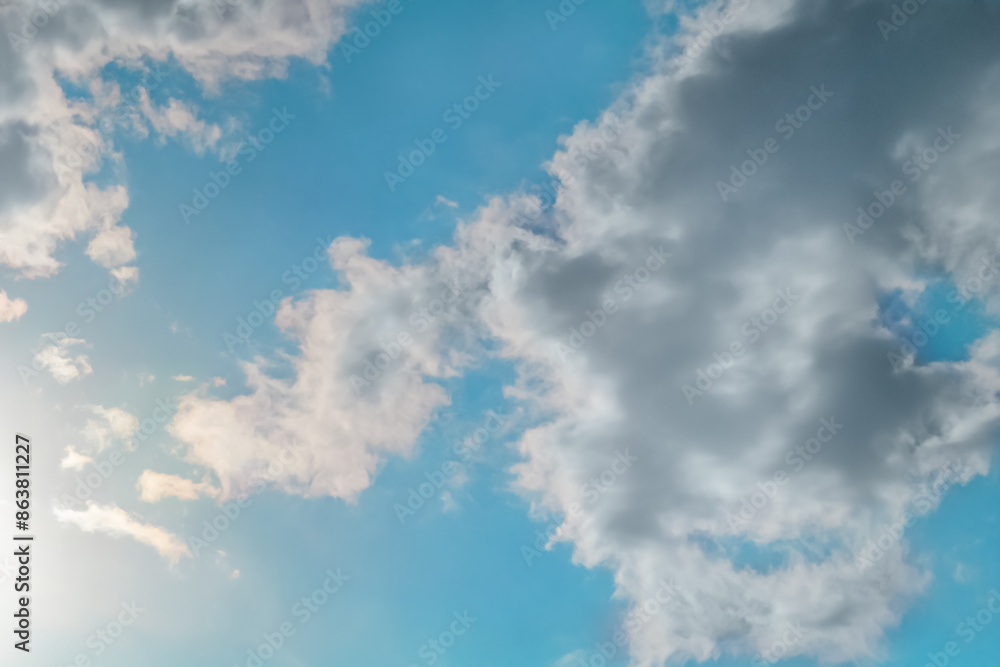 White clouds almost completely covered the blue of the clear sky. Background for art blanks, wallpaper for the computer desktop, screensaver White clouds almost completely covered the blue of the clear sky. Background for art blanks, wallpaper for the computer desktop, screensaver