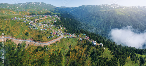 Obraz na plátně Aerial view of winding mountain road leading to scenic village of Gomismta, Geor