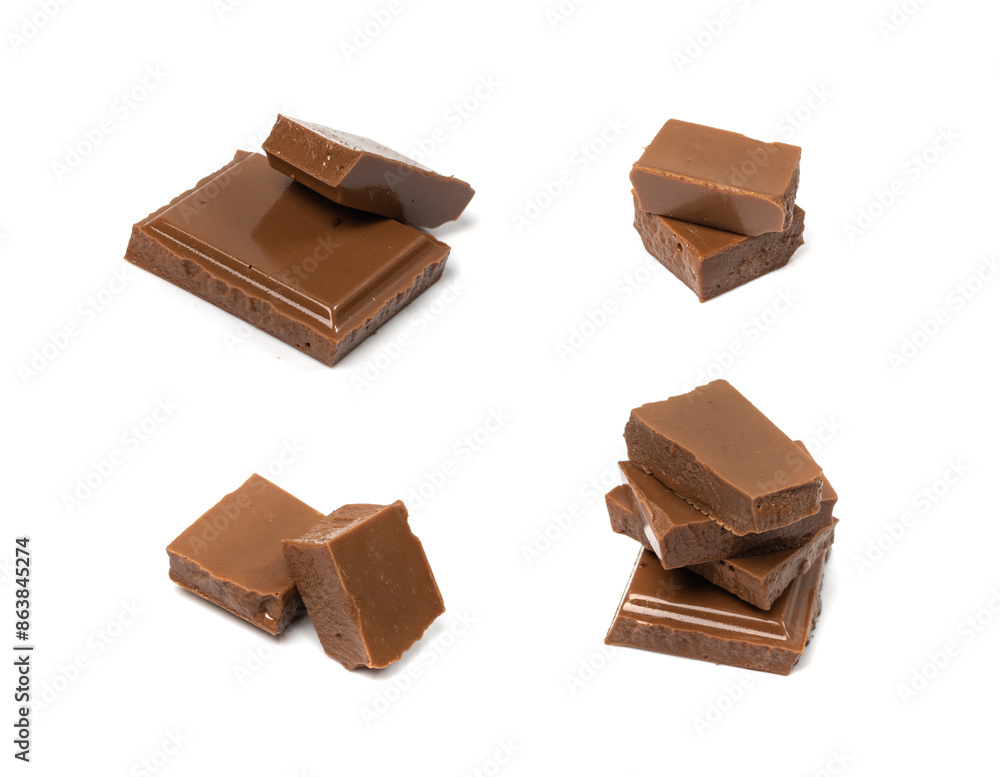 Broken chocolate bar stack, isolated. Milk chocolate square pieces, cubes, small bloks pile, choco Broken chocolate bar stack, isolated. Milk chocolate square pieces, cubes, small bloks pile, choco