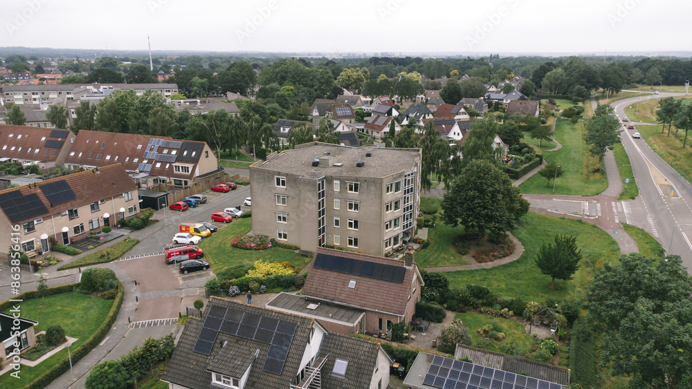 Obraz premium Aerial shot of apartment building flat in a street in a residential area neighborhood in Steenwijk, Overijssel, The Netherlands.