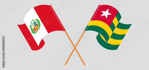 Crossed and waving flags of Peru and Togo