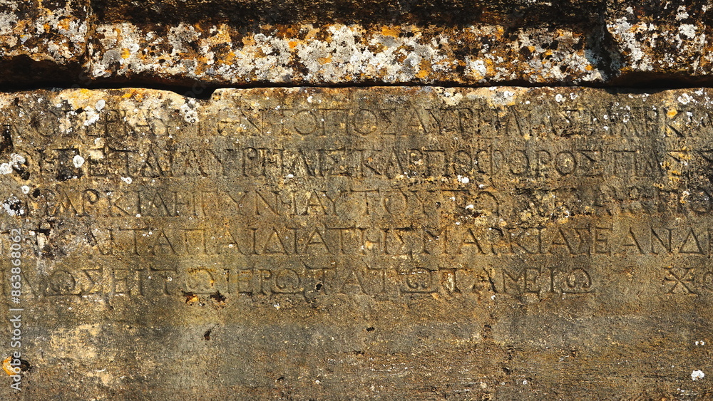 Fototapeta premium Ancient Stone Inscriptions Close-Up Textured Surface