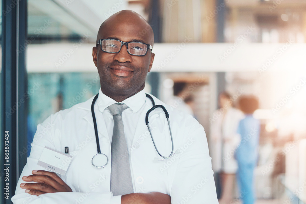 Doctor, portrait and confidence of black man for healthcare, wellness or medical experience with stethoscope. Hospital, smile and pride in health facility with crossed arms for cardiology or medicine Doctor, portrait and confidence of black man for healthcare, wellness or medical experience with stethoscope. Hospital, smile and pride in health facility with crossed arms for cardiology or medicine