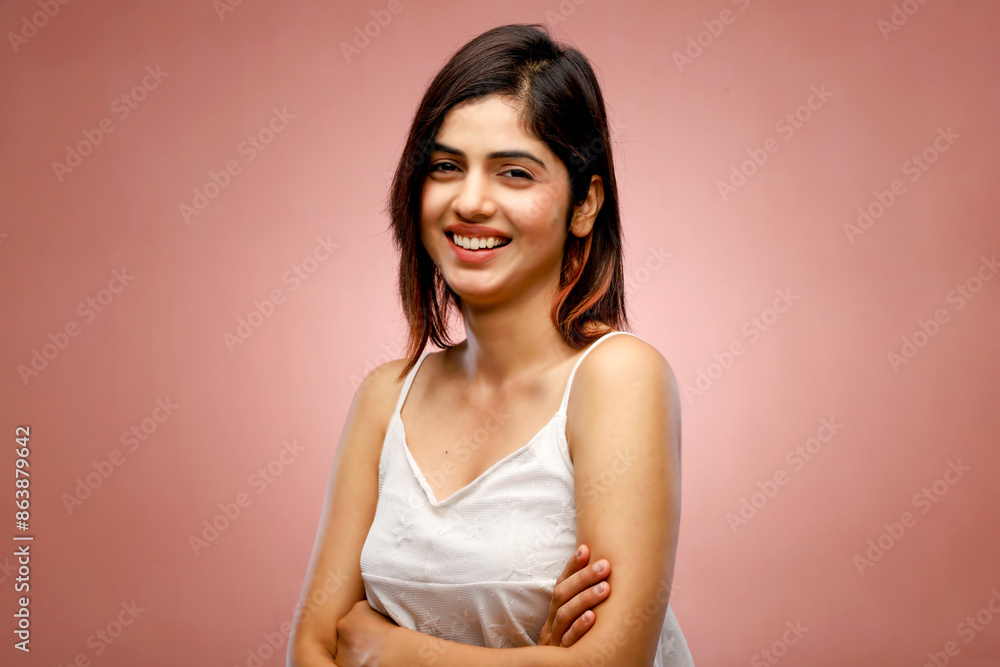 Smiling Brunette Woman With Folded Arms In White Top Smiling Brunette Woman With Folded Arms In White Top