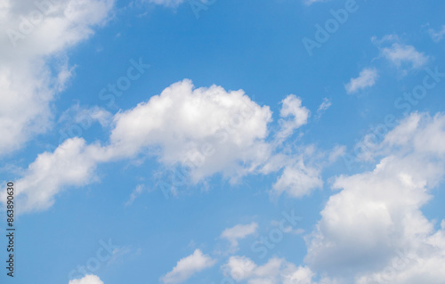 Blue sky background, white clouds in the sky.
