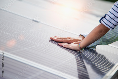 Father and daughter on a solar farm filled with solar panels. Solar energy for future generations Resource saving concept Electrical energy sources and alternative energy.