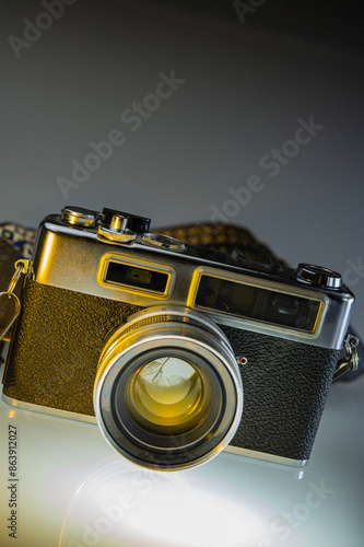 An old rangefinder film camera on gray. photo