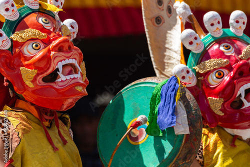 A colorful mask dance and drum beating being performed at Hemis Monastery at Leh, Ladakh India.