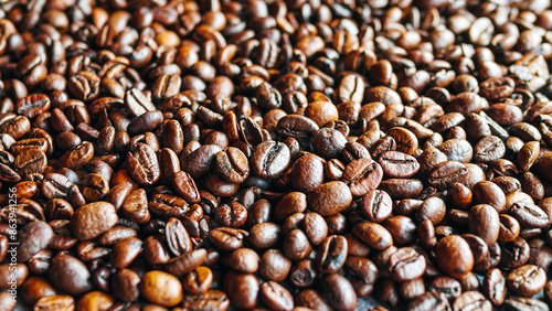Close up of backdrop dark brown coffee beans and Textured background of freshly roasted coffee beans