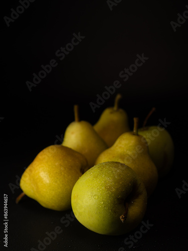 pears on black background