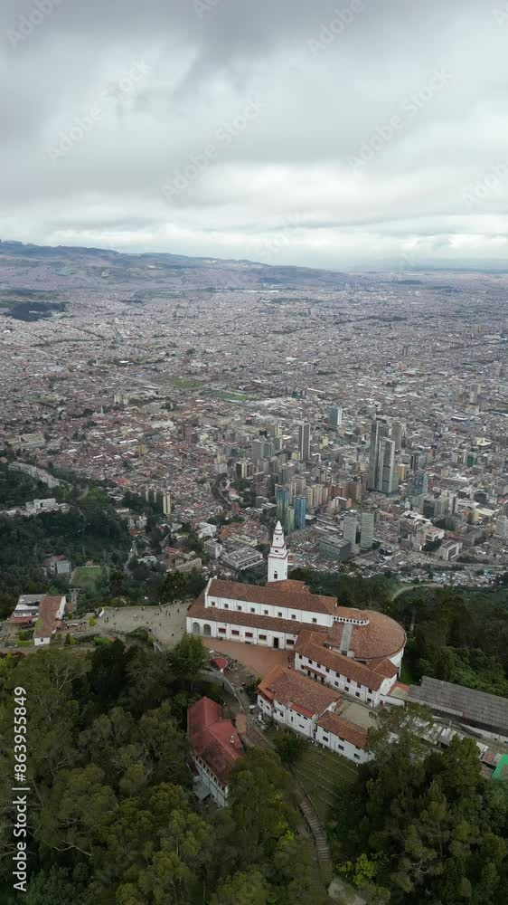 Aerial view: Monserrate church in Bogota, Capital of Colombia, Bogota downtown in the background