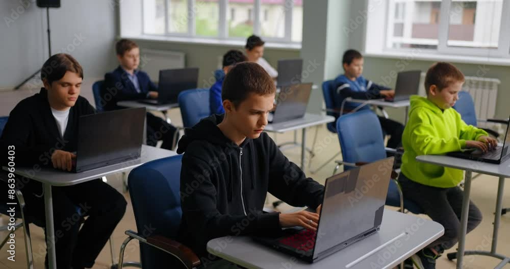 Education For Children, Teens Boys In Programming, Pupils With Laptops In Computer-Based Classroom Education For Children, Teens Boys In Programming, Pupils With Laptops In Computer-Based Classroom