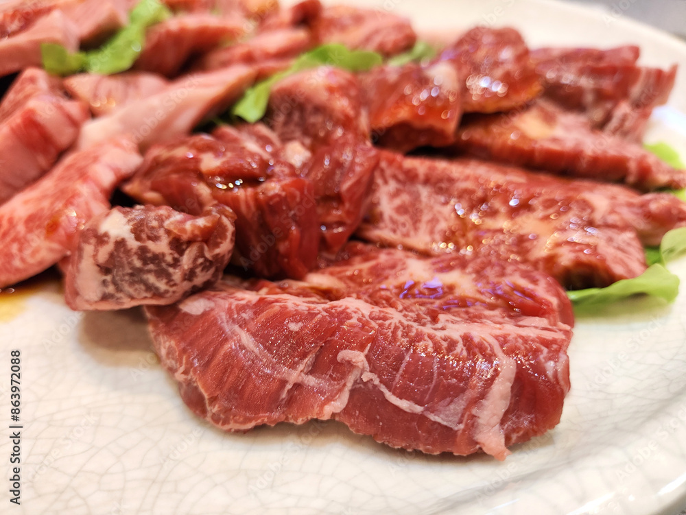 Premium Japanese wagyu beef sliced on plate for bbq Premium Japanese wagyu beef sliced on plate for bbq