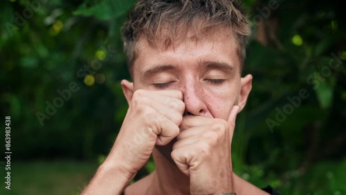 Wallpaper Mural Man Doing Face Massage by Hands at Yoga Meditation in Green Park. Close Up Shot of Attractive Yogi Working on Facial Skin Youth and Wrinkles by Fingers. Modern Asian Healthcare of Alone Guy in Garden Torontodigital.ca