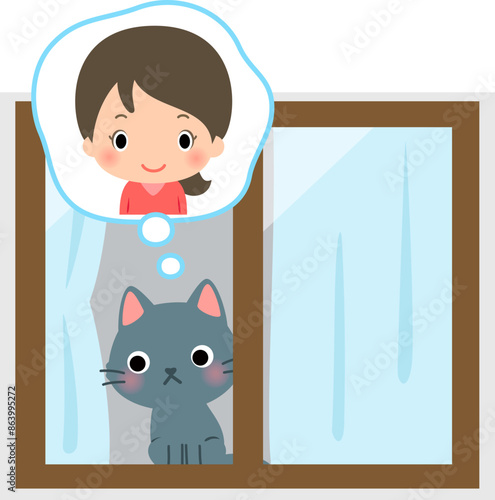 窓の内側で飼い主の帰宅を待っている猫