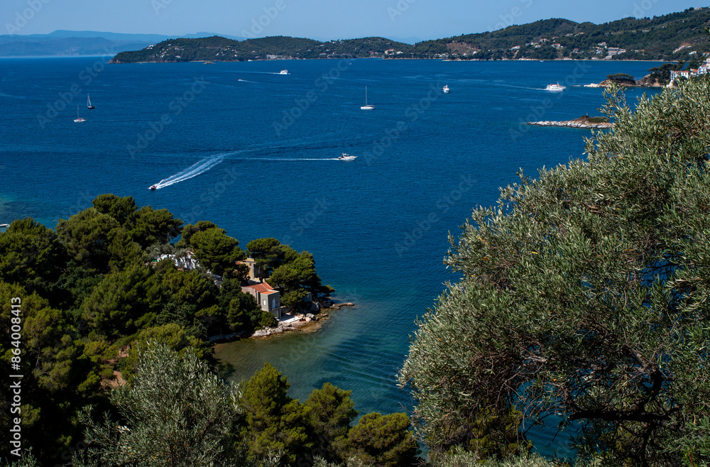 Greek island panorama view, seascape with the blue Aegean waters. Skiathos old town, white washed town houses, holiday, vacation destination Greek island panorama view, seascape with the blue Aegean waters. Skiathos old town, white washed town houses, holiday, vacation destination