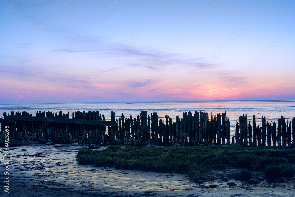 Fototapeta premium Dutch Mud Flats at sunset with Panoramic view over the tidal flats along the shore of the netherlands