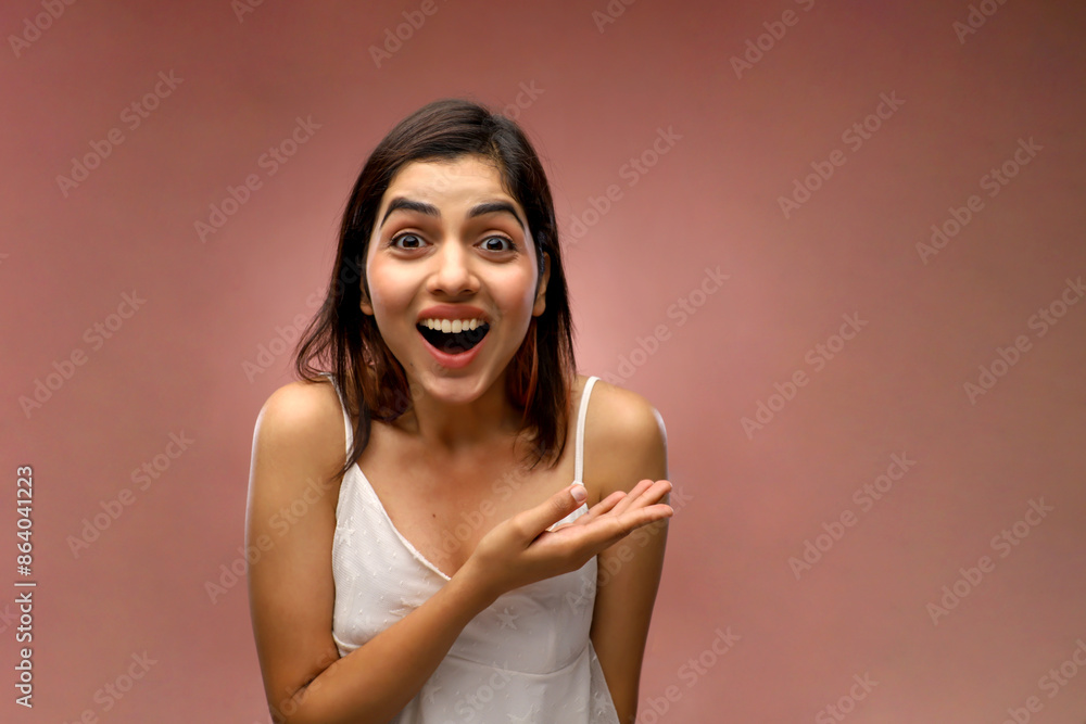 Fototapeta premium A Beautiful Woman Is Laughing While Standing In Front Of The Camera