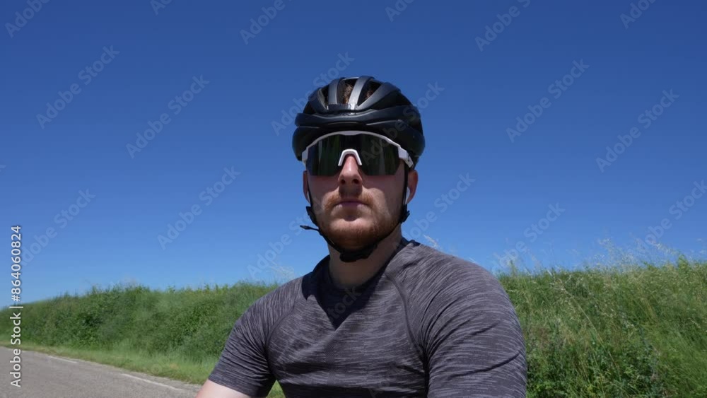 Portrait of a Cyclist Paused on a Country Road Portrait of a Cyclist Paused on a Country Road