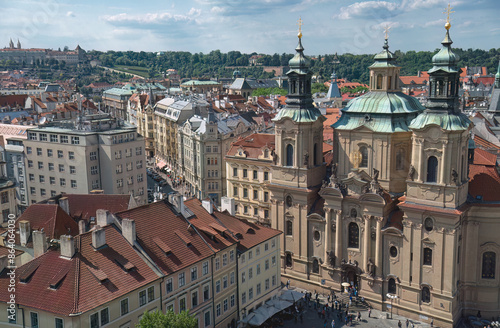 Wallpaper Mural Tourists walking in the streets of Prague with a view on the st. Nicholas, Czech Republic Torontodigital.ca