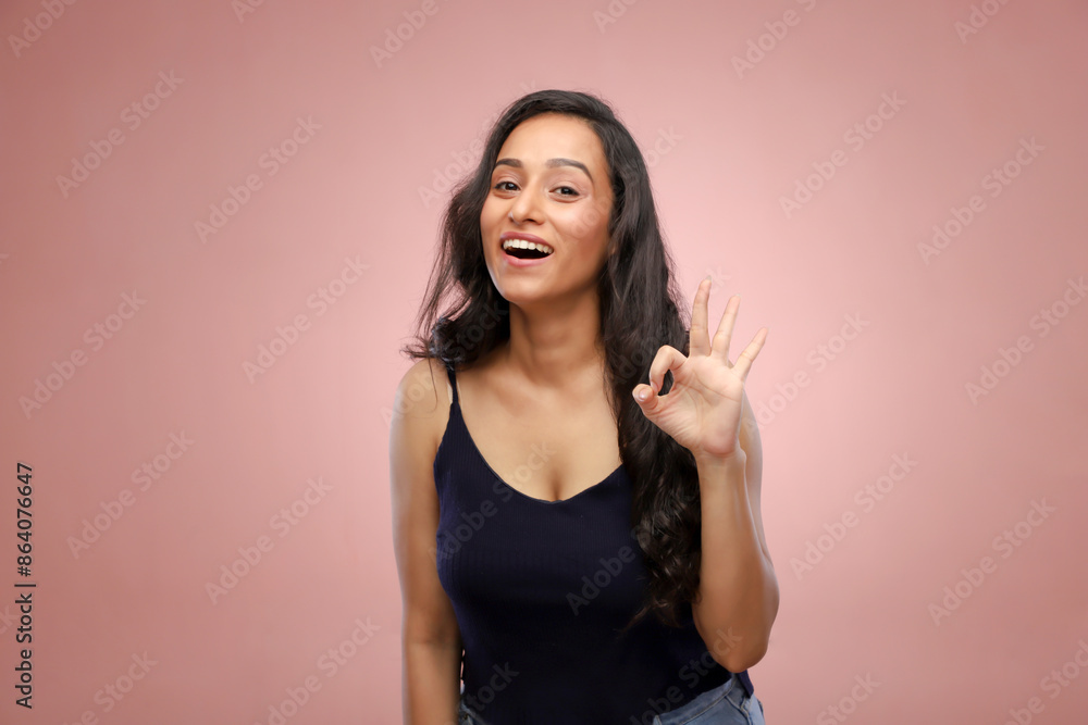 An Incredible Woman Smiling And Showing Ok Sign
An Incredible Woman Smiling And Showing Ok Sign