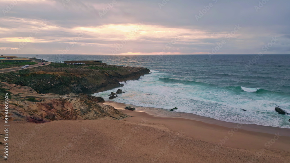 Aerial rocky sea shore washed by foamy water at evening dusk. Coastal cliffs Aerial rocky sea shore washed by foamy water at evening dusk. Coastal cliffs