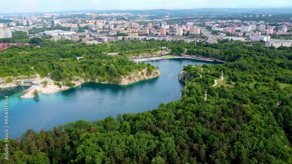 turquoise water surrounded by lush forests offers a serene escape close to the city. Krakow, Poland - Kraków, Polska turquoise water surrounded by lush forests offers a serene escape close to the city. Krakow, Poland - Kraków, Polska