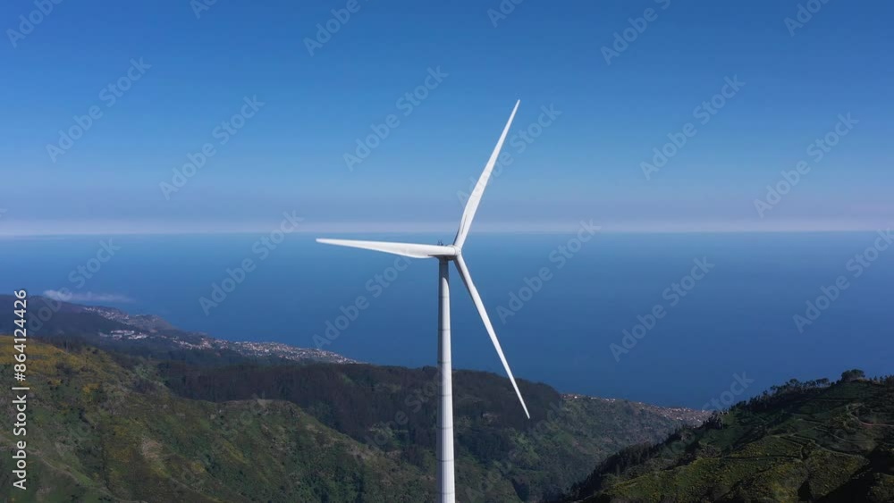 Wind Turbine in Mountains of Madeira on Sunny Day. Portugal. Aerial Drone Shot. Orbiting Wind Turbine in Mountains of Madeira on Sunny Day. Portugal. Aerial Drone Shot. Orbiting