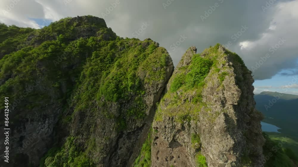 Drone flying fast over the cliffs down towards the beach at Le Morne Brabant in Mauritius Drone flying fast over the cliffs down towards the beach at Le Morne Brabant in Mauritius