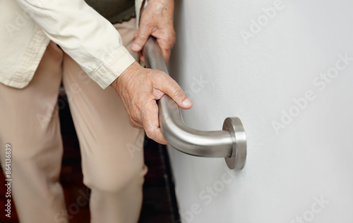 Elderly Woman Holding Handrail for Support