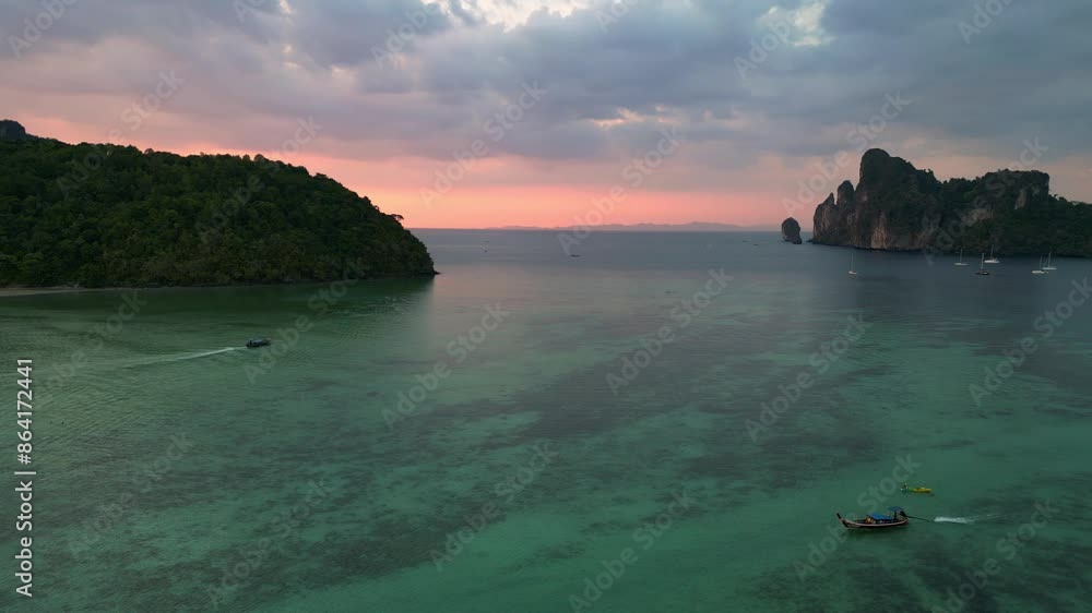 Sunset orange pink sky tropical island, boats. Gorgeous aerial view flight drone Sunset orange pink sky tropical island, boats. Gorgeous aerial view flight drone
