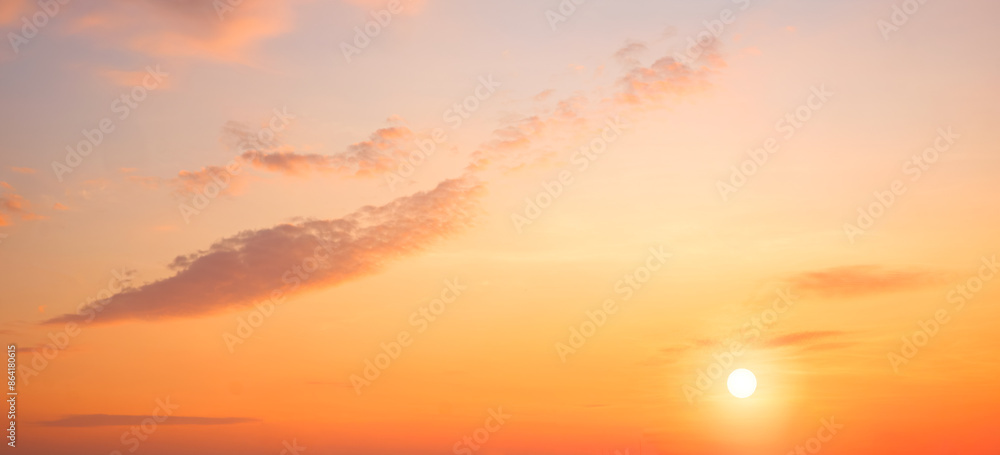 Obraz premium Sunrise sky in the morning with colorful yellow sunlight and cloud on panoramic orange sunset sky background in golden hour time