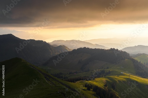 Beautiful landscape view of mountain layers illuminated by a gorgeous sunset light
