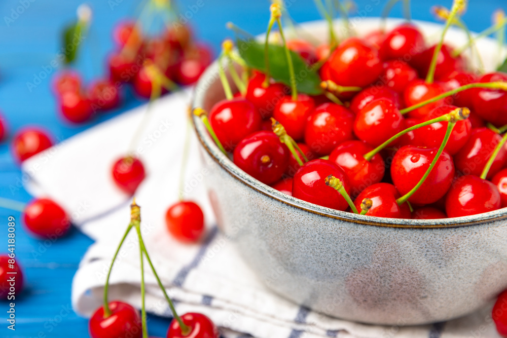 Cherries. Fresh ripe cherries with leaves on a textured wooden background. Fresh sweet organic cherry pile. Berries and fruits. Vegan. Healthy eating. Place for text. Copy space Cherries. Fresh ripe cherries with leaves on a textured wooden background. Fresh sweet organic cherry pile. Berries and fruits. Vegan. Healthy eating. Place for text. Copy space