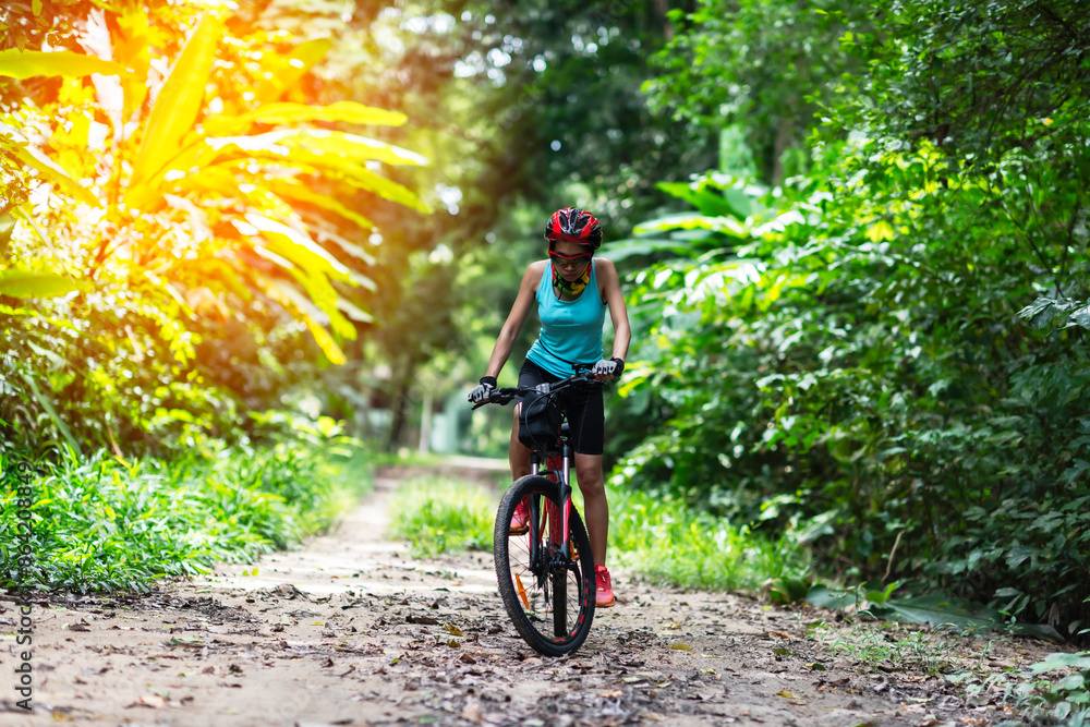 Asian are cycling road bike in the morning Asian are cycling road bike in the morning
