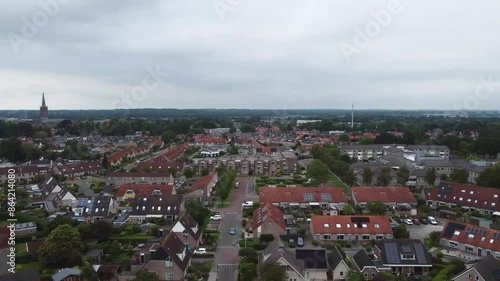 Aerial shot of houses with solar panels on roof in a street in a residential area neighborhood in Steenwijk, Overijssel, The Netherlands. photo