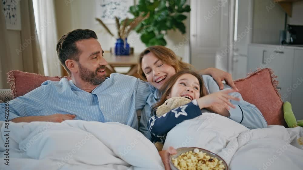 Carefree parents daughter resting couch at home closeup. Girl feeding father