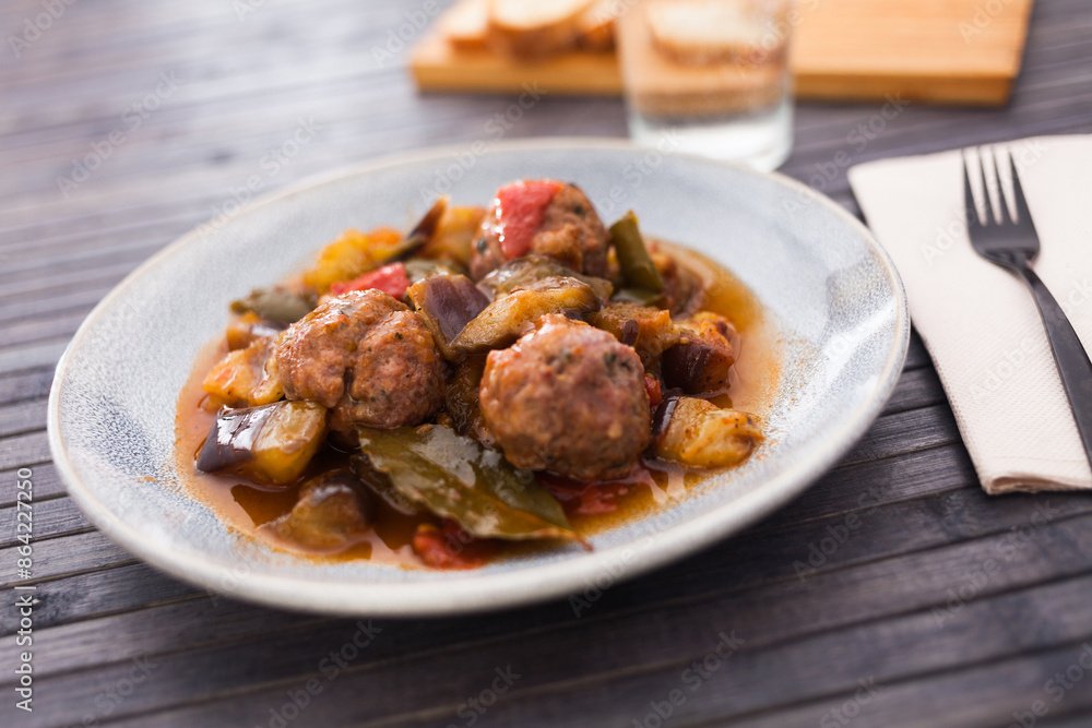 Steamed meatballs with stewed vegetables on plate Steamed meatballs with stewed vegetables on plate