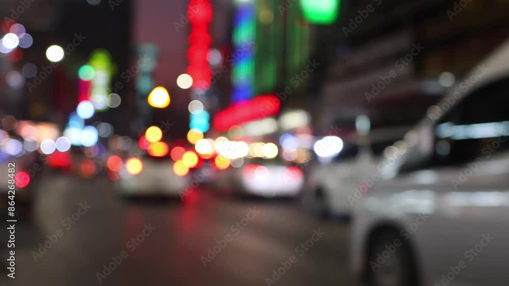 Road traffic at Yaowarat Road (Chinatown) in Bangkok, Thailand. Bokeh of cars and blurred traffic lights. Road traffic at Yaowarat Road (Chinatown) in Bangkok, Thailand. Bokeh of cars and blurred traffic lights.