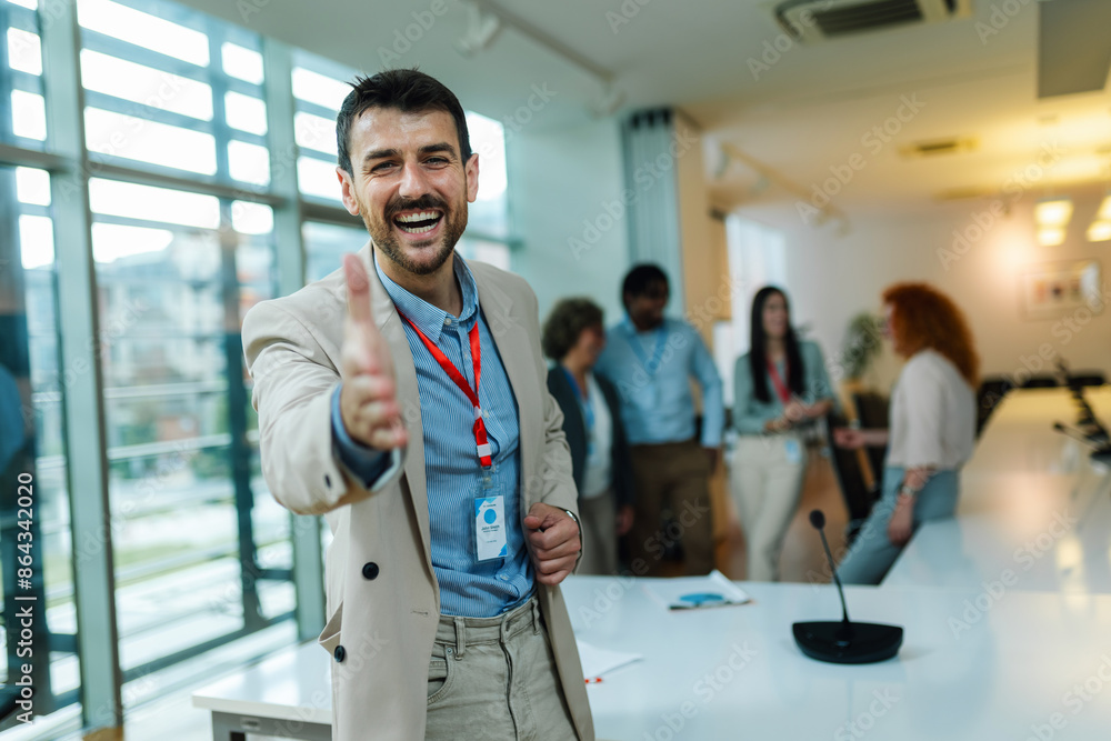 Portrait of businessman welcoming someone ready to shake hands. Portrait of businessman welcoming someone ready to shake hands.