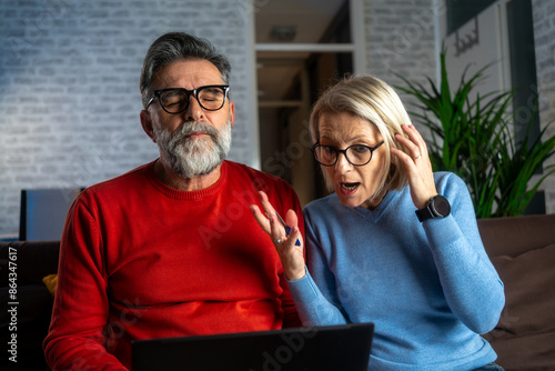 Billede på lærred Household financial economic concept, Stressed Married Couple are looking at credit card bills issued documents, and apartment loan mortgages and worrying about having no money to pay
