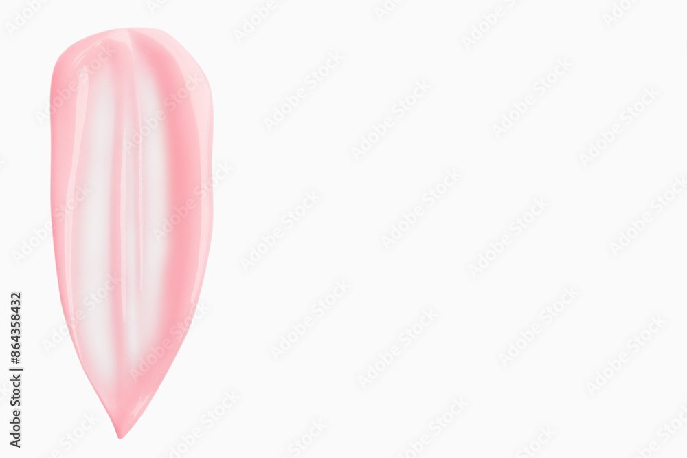 A smear of pink cream on a light background A smear of pink cream on a light background