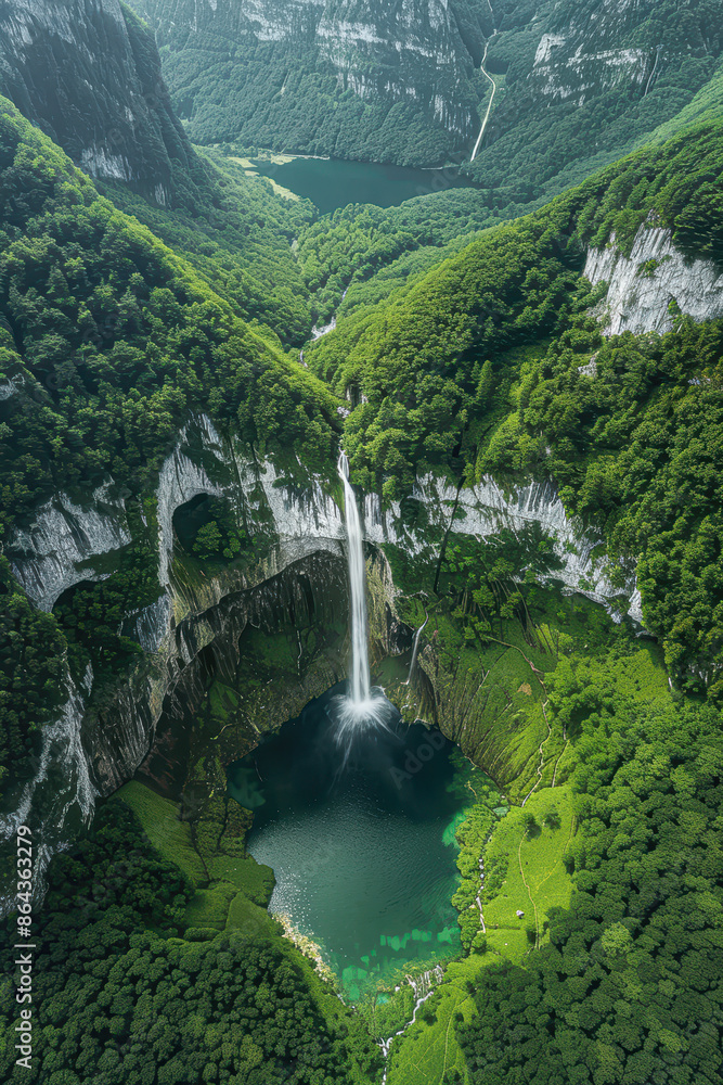 Fototapeta premium Majestic Heart Shaped Waterfall Aerial View of Stunning Green Forest and Crystal Clear Lake with Mirror-Like Reflection of Sky