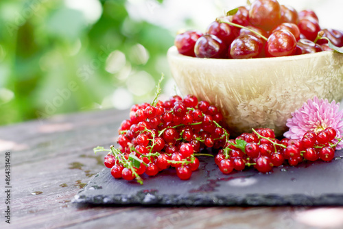 Fresh red currant and cherry, healthy organic fruit on table