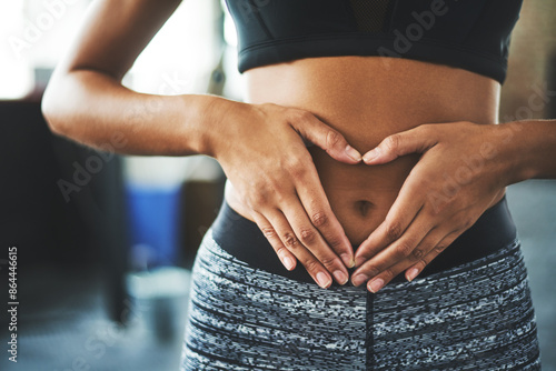 Foto Health, digestion and hands on stomach for woman in gym, nutrition and gut support detox