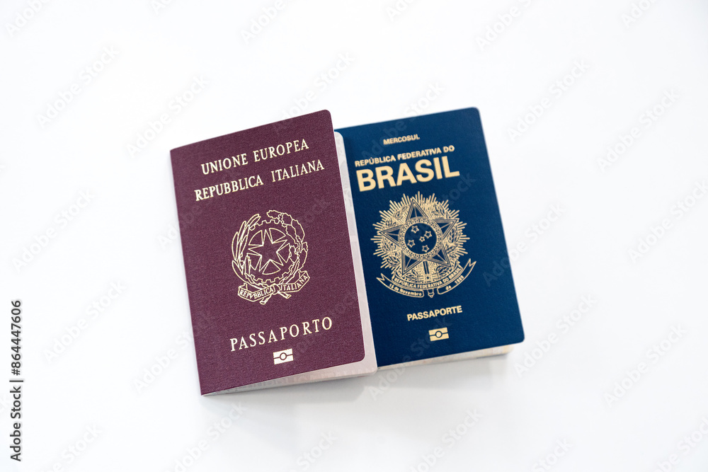 Italian and Brazilian passports on a white background Italian and Brazilian passports on a white background