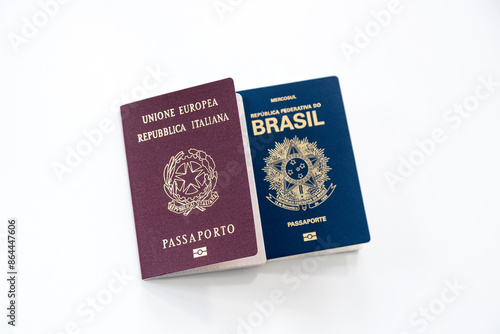 Italian and Brazilian passports on a white background. Selective focus