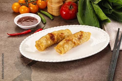 Vietnamese stuffed spring roll served sauce