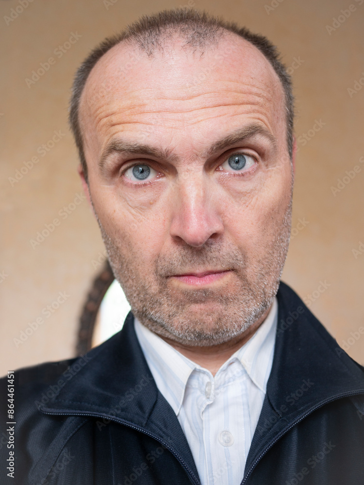 Vertical photo of an elderly unshaven man. Vertical photo of an elderly unshaven man.