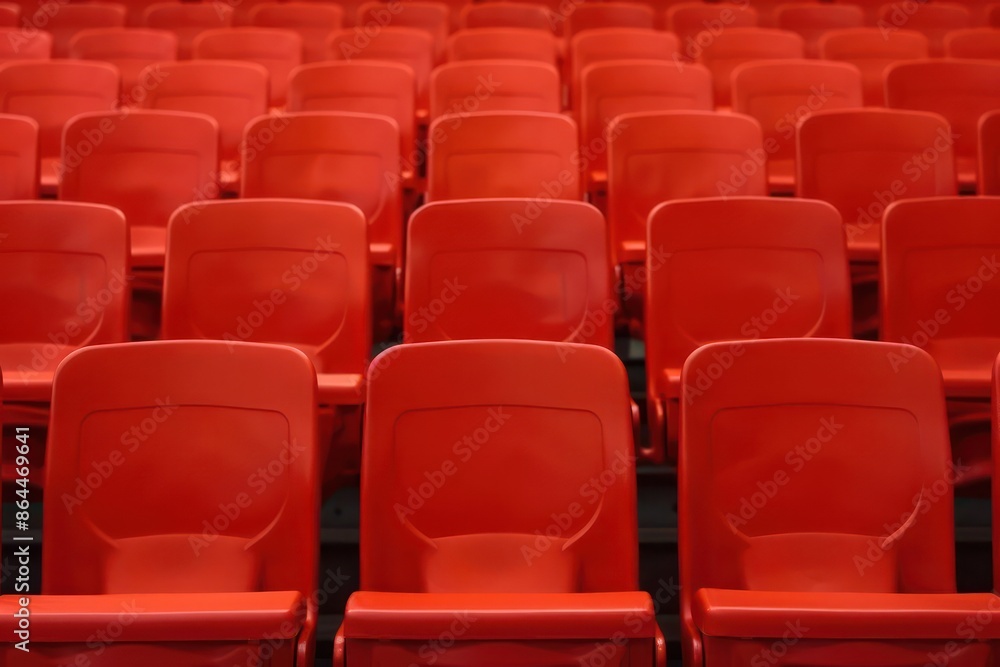 An auditorium with rows of empty seats, perfect for a banner with ample room for text An auditorium with rows of empty seats, perfect for a banner with ample room for text